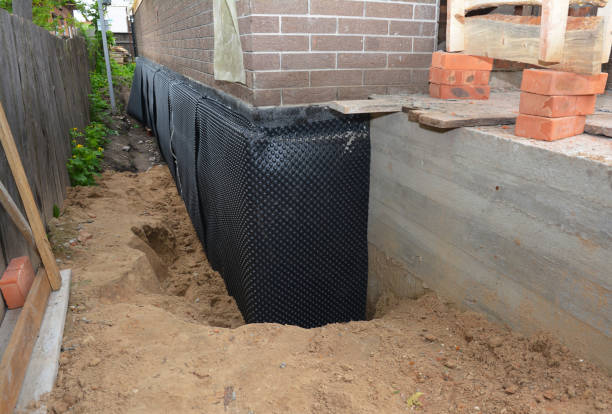 SJ Waterproofing Pros technician performing targeted Exterior Waterproofing assessment in Pineville, KY